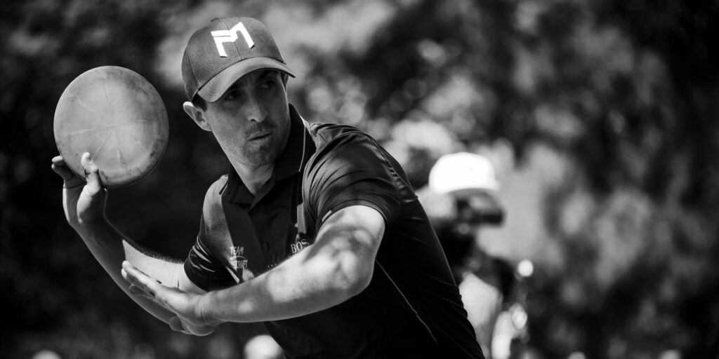 Paul McBeth with his arm back, getting ready to throw a forehand throw.