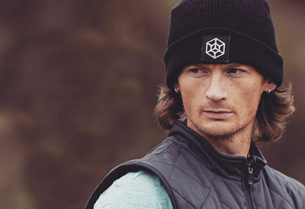 Ben Callaway, wearing a GRIPeq beanie, looking to the left side of the frame.