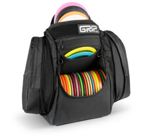 Black AX6 disc golf bag opened and filled with discs