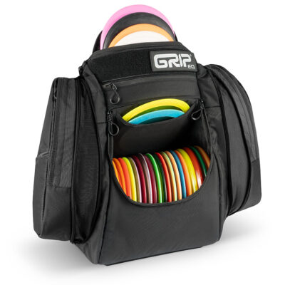 Black AX6 disc golf bag opened and filled with discs