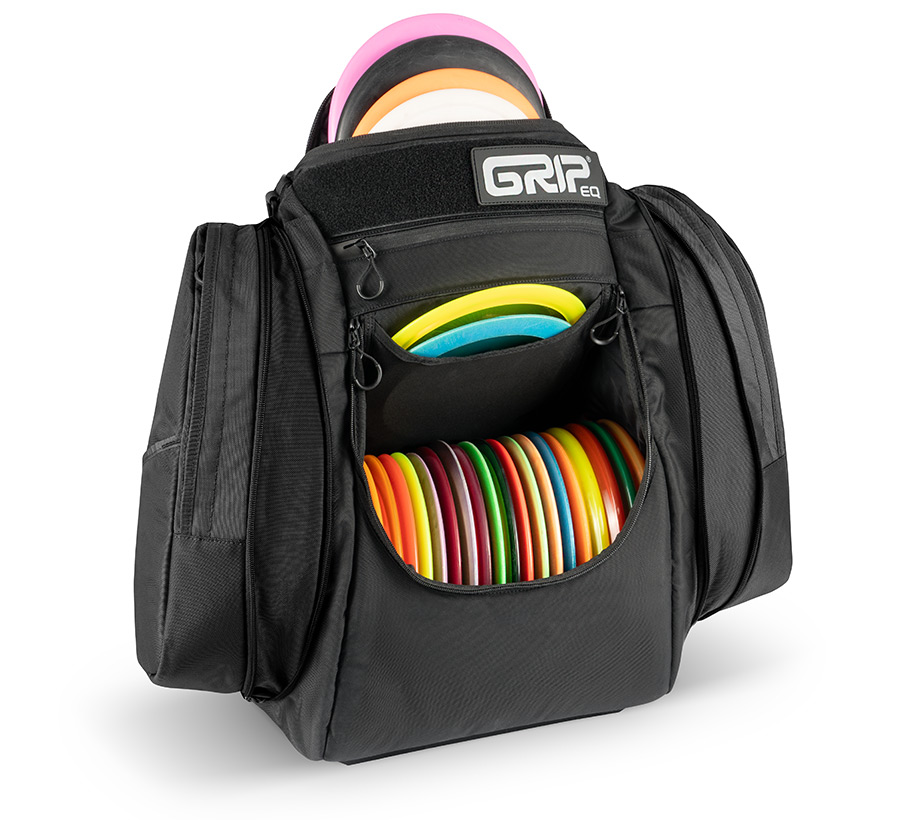 Black AX6 disc golf bag opened and filled with discs