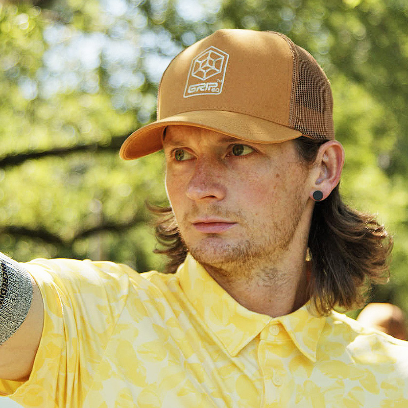 A headshot of Team GRIPeq member, Ben Callaway. He is looking intently to the left side of the frame.