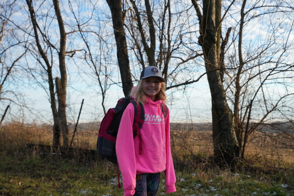 Team GRIPeq member Genevieve Davis walking with her GRIPeq bag on her back.