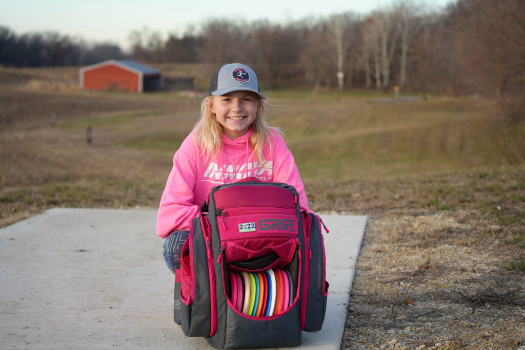 Team GRIPeq member Genevieve Davis walking with her GRIPeq bag on the ground in front of her.