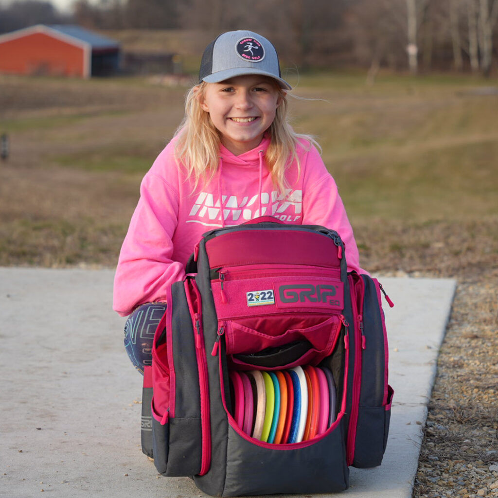 Team GRIPeq member Genevieve Davis walking with her GRIPeq bag on the ground in front of her.
