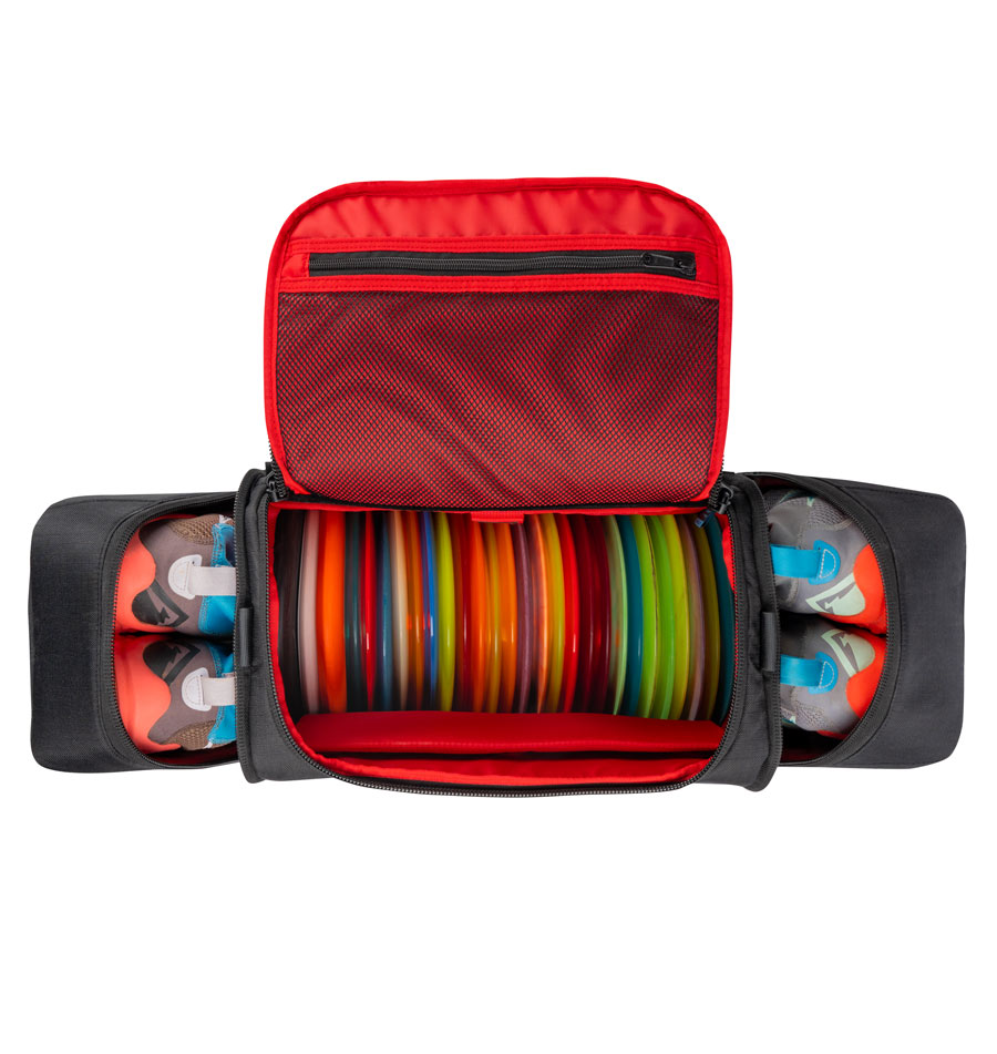 A top-down view of the GRIPeq MB-TSD1 sitting on a white background. It is loaded with disc golf discs and shoes.