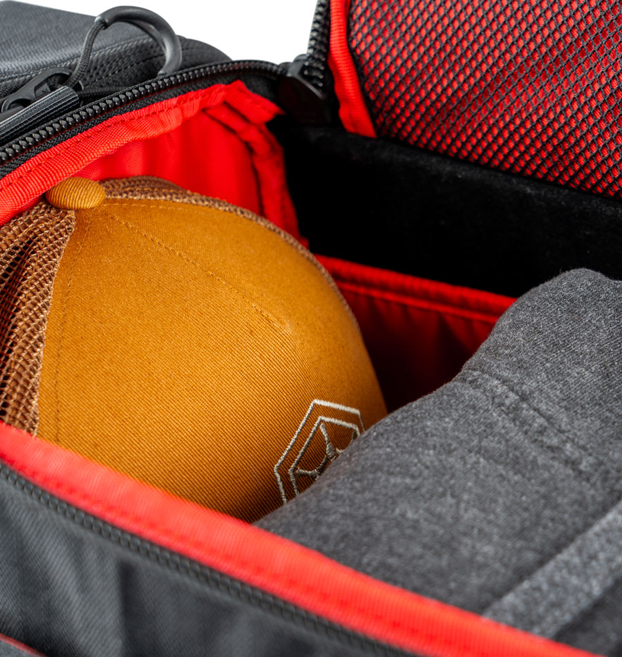 A detail of the GRIPeq MB-TSD1 showing a hat and hoodie stored inside.