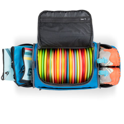 Blue disc golf duffel fully loaded with discs, shoes, and towels